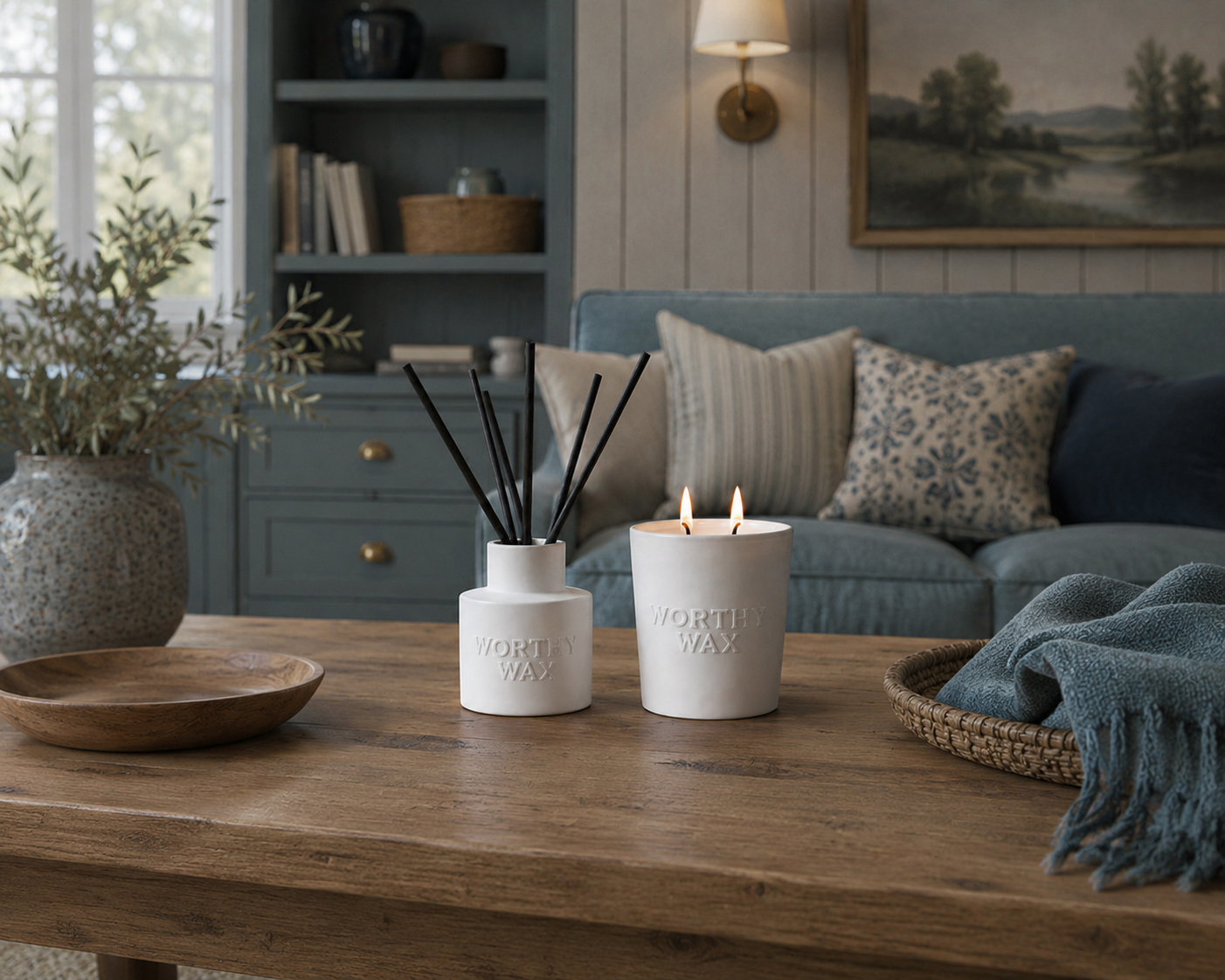 Worthy Wax ceramic candle and reed diffuser on a wooden table
